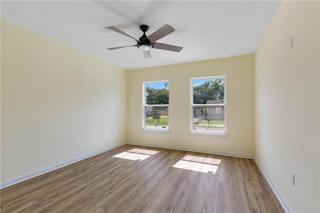 unfurnished room featuring ceiling fan and light hardwood / wood-style floors