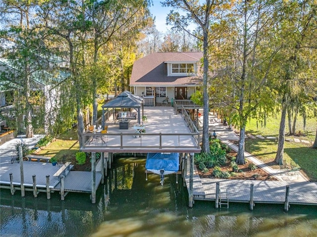 back of house with a deck with water view and a gazebo