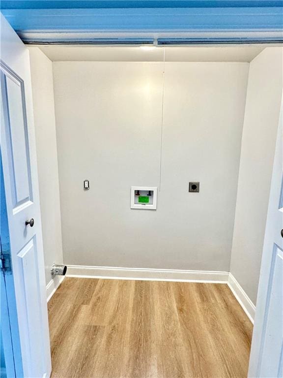 laundry room featuring hookup for a washing machine, hookup for an electric dryer, and light hardwood / wood-style flooring