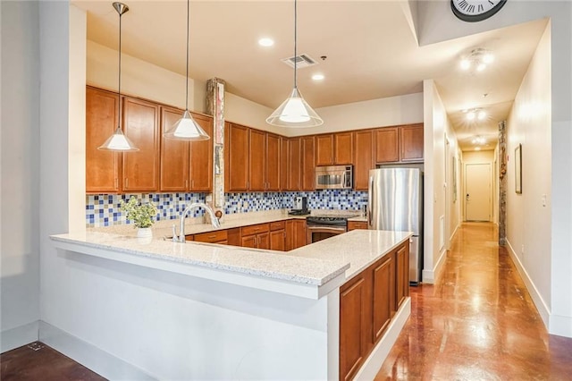 kitchen with decorative backsplash, kitchen peninsula, light stone counters, stainless steel appliances, and decorative light fixtures