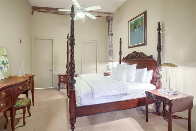 bedroom with ceiling fan and light carpet