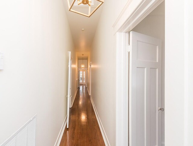 corridor featuring dark hardwood / wood-style flooring