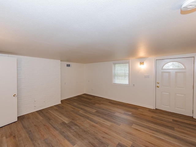 foyer entrance with dark hardwood / wood-style flooring