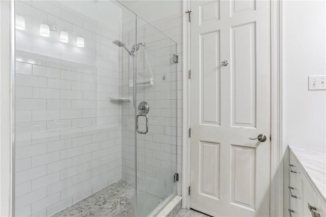 bathroom with vanity and an enclosed shower