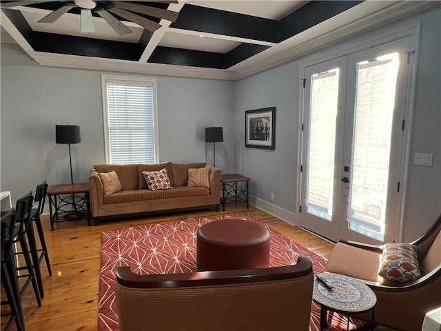 living room with hardwood / wood-style floors, french doors, coffered ceiling, and ceiling fan