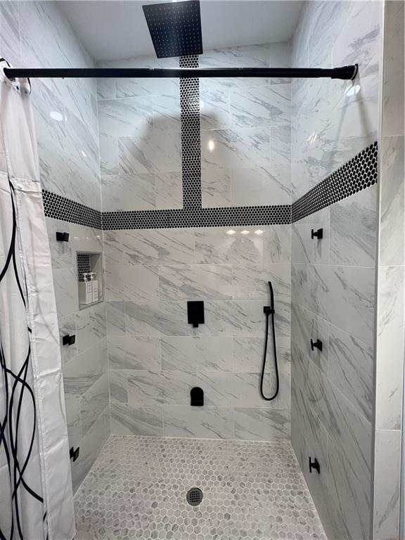 bathroom with a shower with curtain