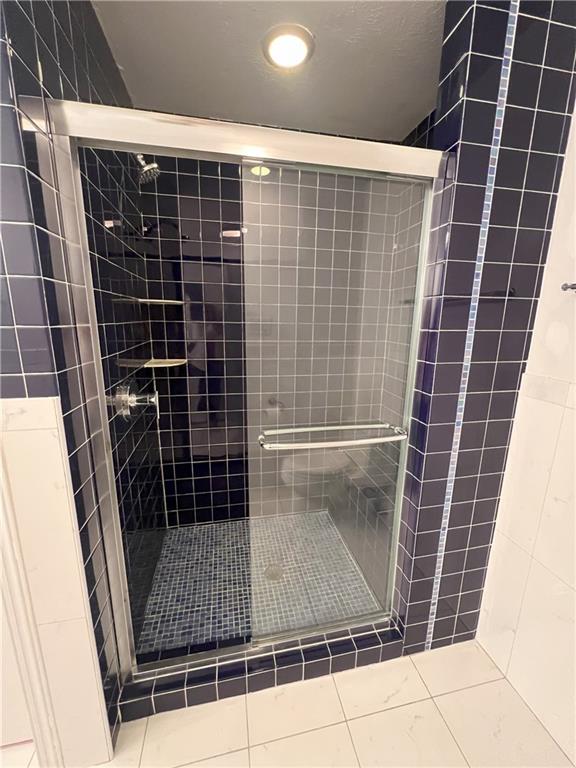 bathroom with an enclosed shower