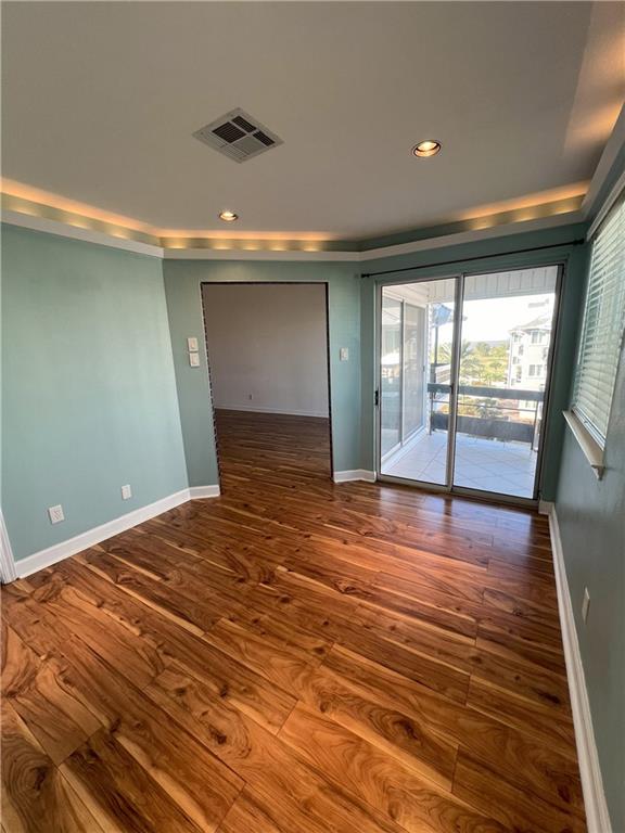 empty room featuring hardwood / wood-style flooring