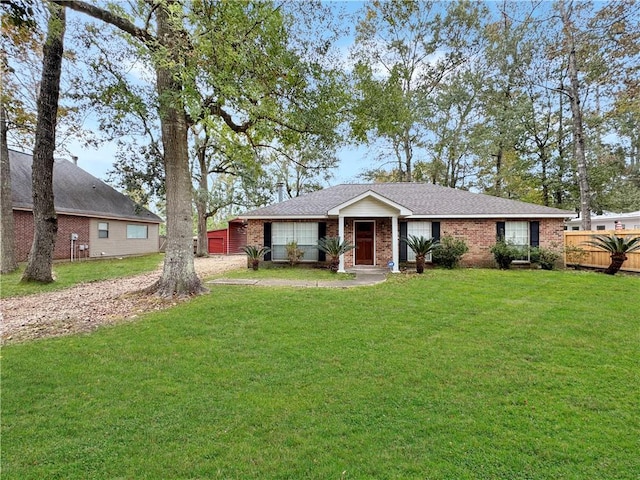 single story home featuring a front yard