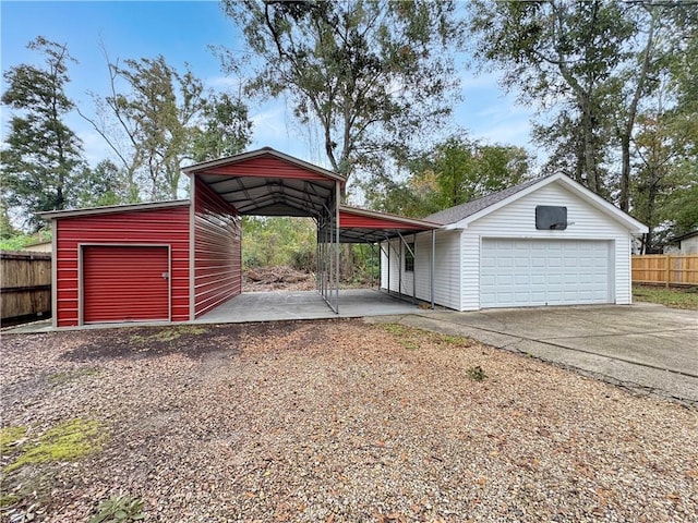 garage featuring a carport