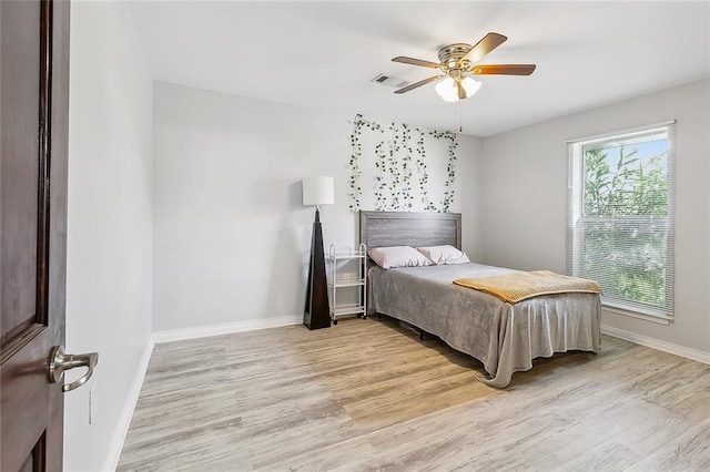 bedroom featuring ceiling fan and light hardwood / wood-style floors