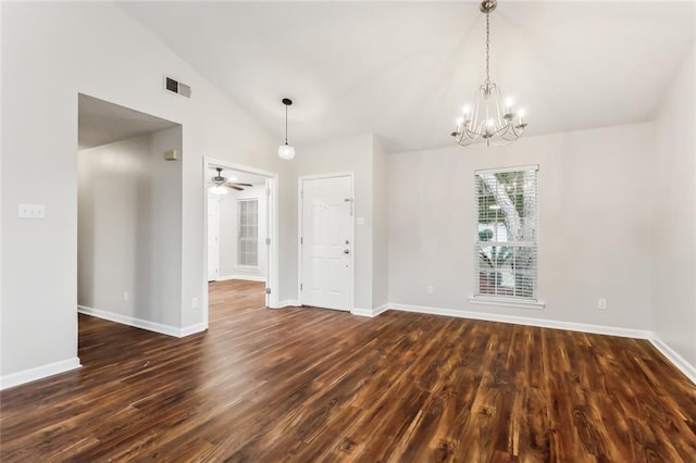 spare room with lofted ceiling, ceiling fan with notable chandelier, and dark hardwood / wood-style floors