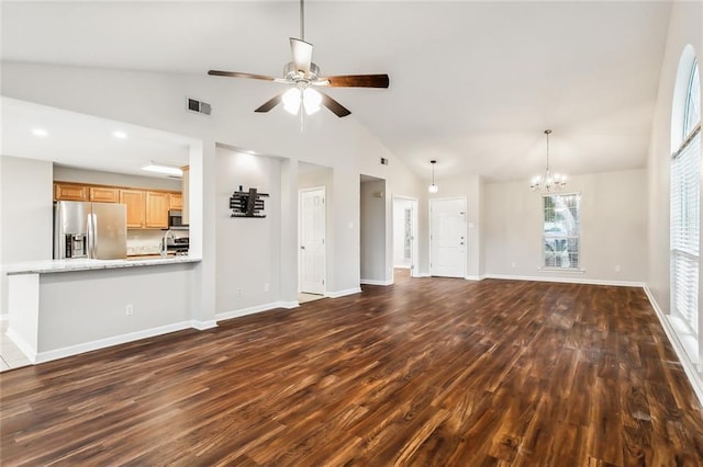 unfurnished living room featuring dark hardwood / wood-style floors and lofted ceiling