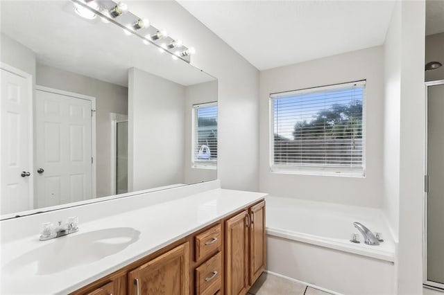 bathroom featuring tile patterned floors, vanity, and independent shower and bath