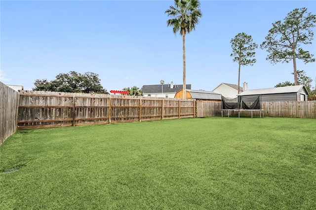 view of yard featuring a trampoline