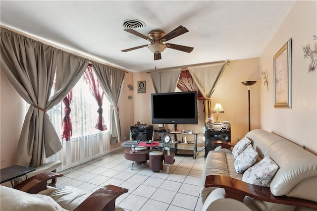 tiled living room with ceiling fan