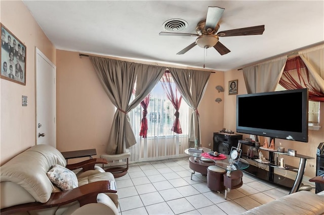 living room with ceiling fan and light tile patterned floors