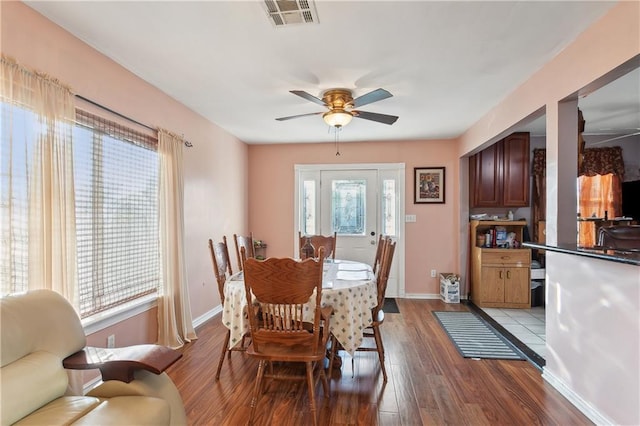 dining room featuring light wood-type flooring and ceiling fan