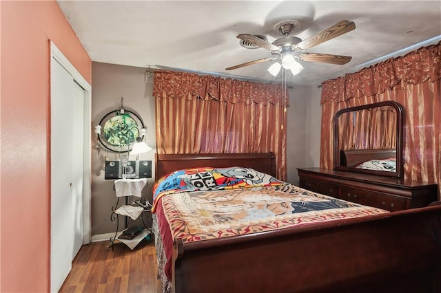 bedroom with hardwood / wood-style flooring and ceiling fan