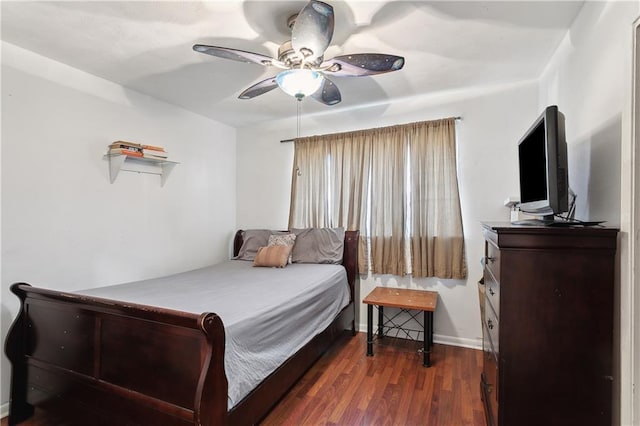 bedroom with ceiling fan and dark hardwood / wood-style floors