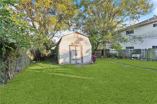 view of outbuilding with a lawn