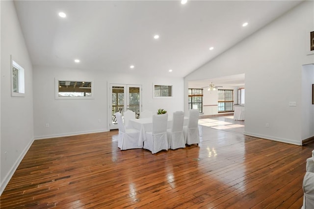 dining space featuring french doors, dark hardwood / wood-style floors, and high vaulted ceiling