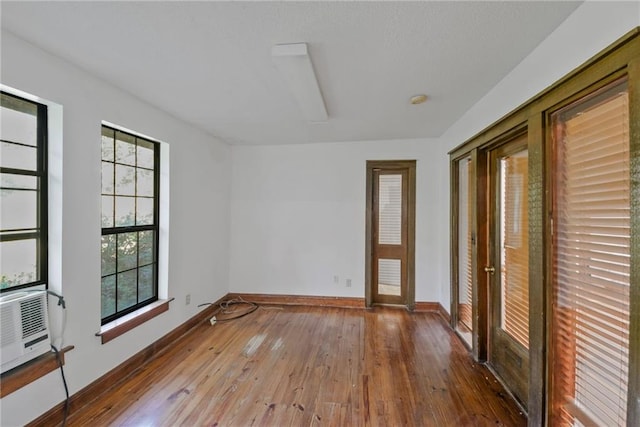 unfurnished room featuring wood-type flooring