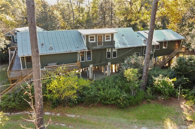 back of house with a balcony