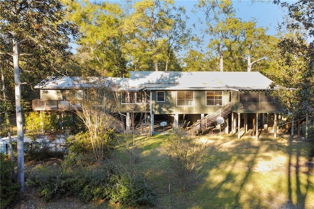 back of house with a lawn