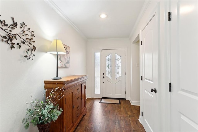 foyer entrance with dark hardwood / wood-style flooring and ornamental molding