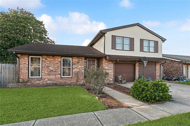 view of front of house featuring a garage and a front lawn