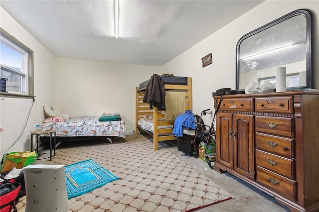 bedroom featuring light colored carpet