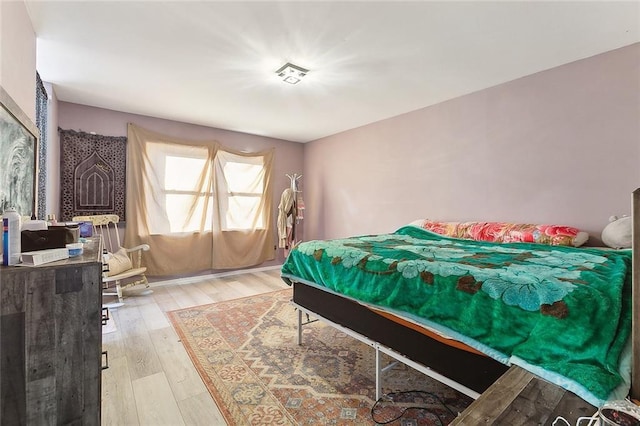 bedroom with light wood-type flooring