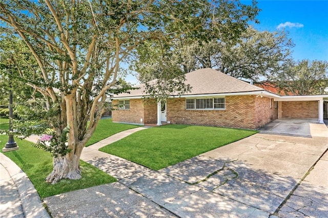 ranch-style house featuring a carport and a front lawn