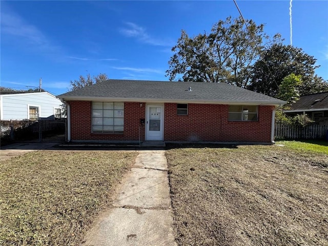 single story home with a front yard