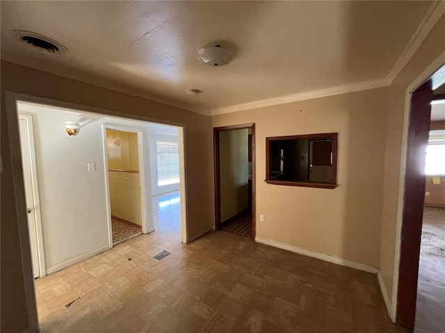 unfurnished room featuring ornamental molding