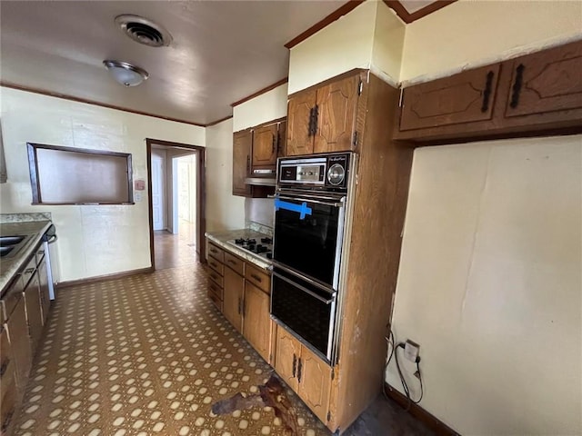 kitchen featuring gas cooktop and black double oven