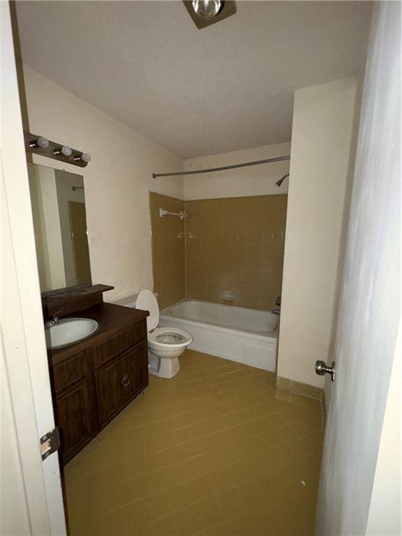 full bathroom with tile patterned floors, tiled shower / bath combo, toilet, and vanity