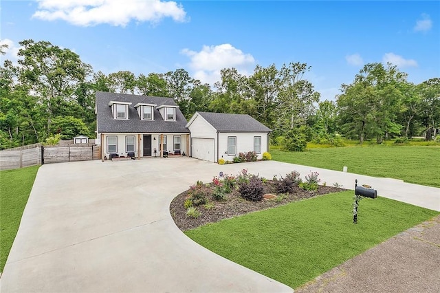 view of front of home featuring a garage and a front lawn