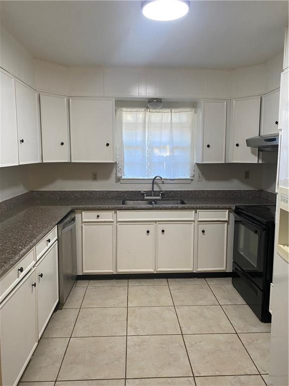 kitchen with dishwasher, white cabinetry, black / electric stove, sink, and light tile patterned floors