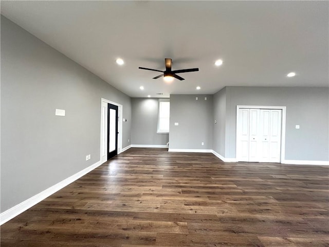 empty room featuring ceiling fan and dark hardwood / wood-style flooring