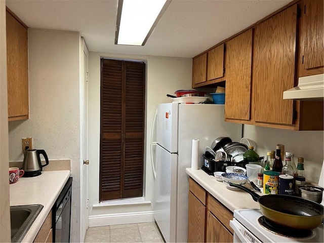 kitchen with ventilation hood, white appliances, light tile patterned floors, and sink