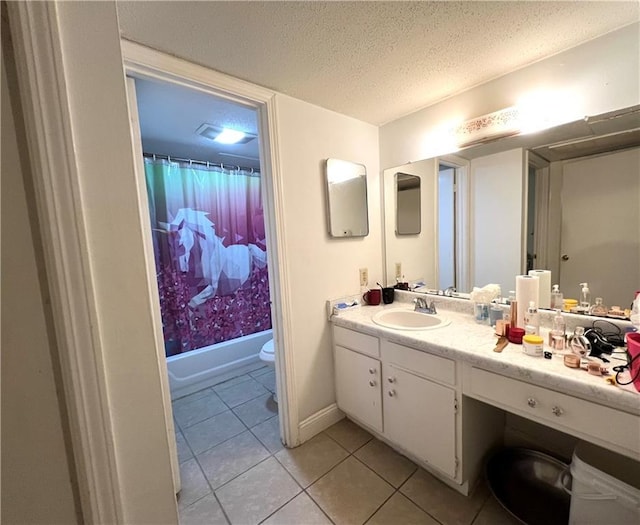 full bathroom with shower / bath combination with curtain, tile patterned floors, a textured ceiling, vanity, and toilet