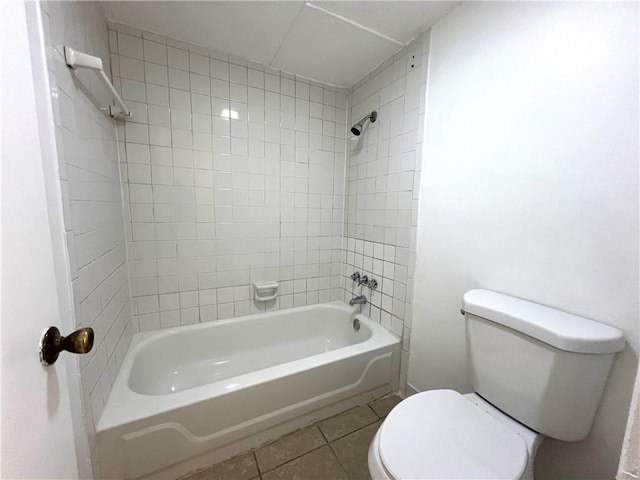 full bathroom featuring toilet, tile patterned floors, and shower / bathtub combination