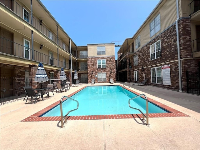 community pool with a patio