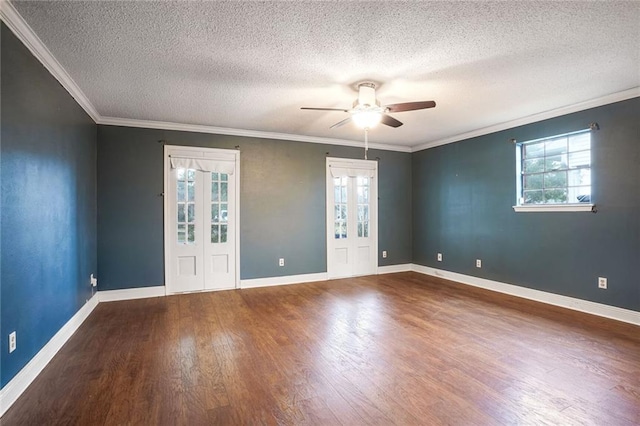 empty room with a textured ceiling, dark hardwood / wood-style floors, ceiling fan, and crown molding