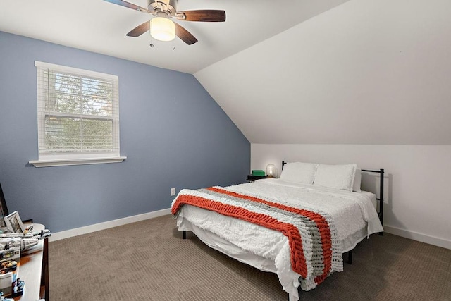 bedroom with ceiling fan, carpet floors, and lofted ceiling