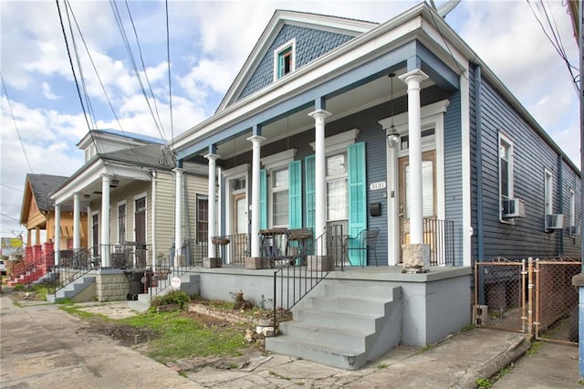 view of property exterior featuring cooling unit and covered porch