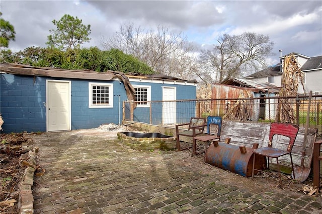 view of patio / terrace featuring a storage unit