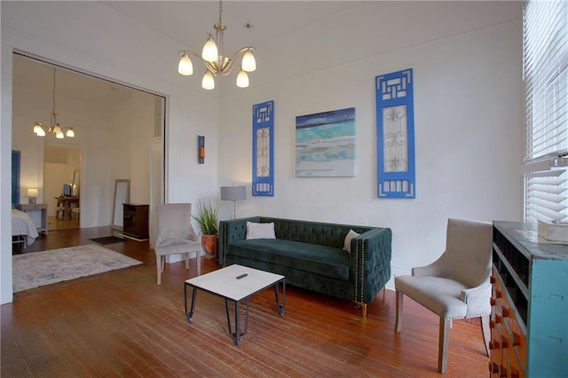 living room with hardwood / wood-style flooring and a chandelier